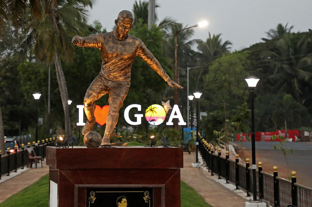 Bronze Cristiano Ronaldo statue in Goa with 'I Love Goa' sign in the background