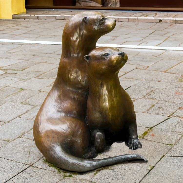 Bronze Otter Lawn Ornament showing one otter lying down while another sits behind it
