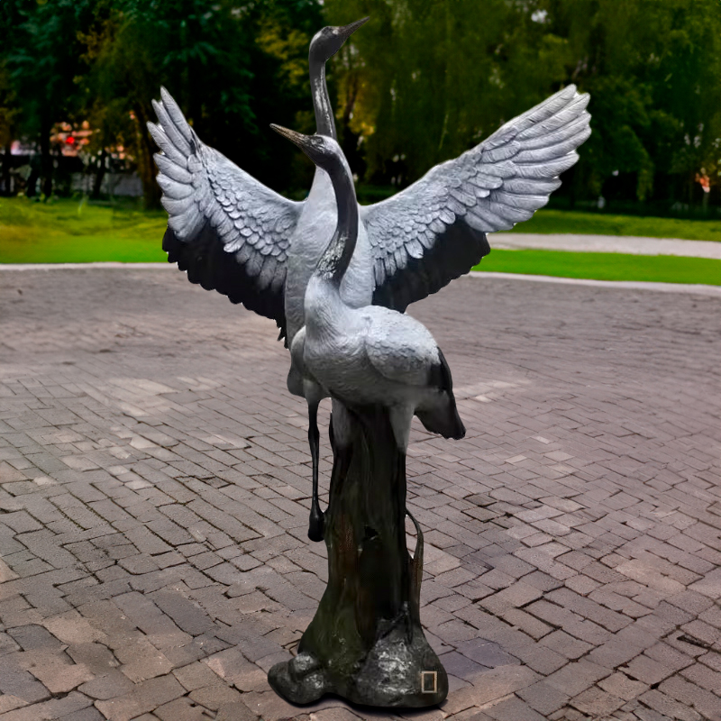 Bronze Red Crowned Crane Statue featuring two cranes, one with wings spread, the other standing tall
