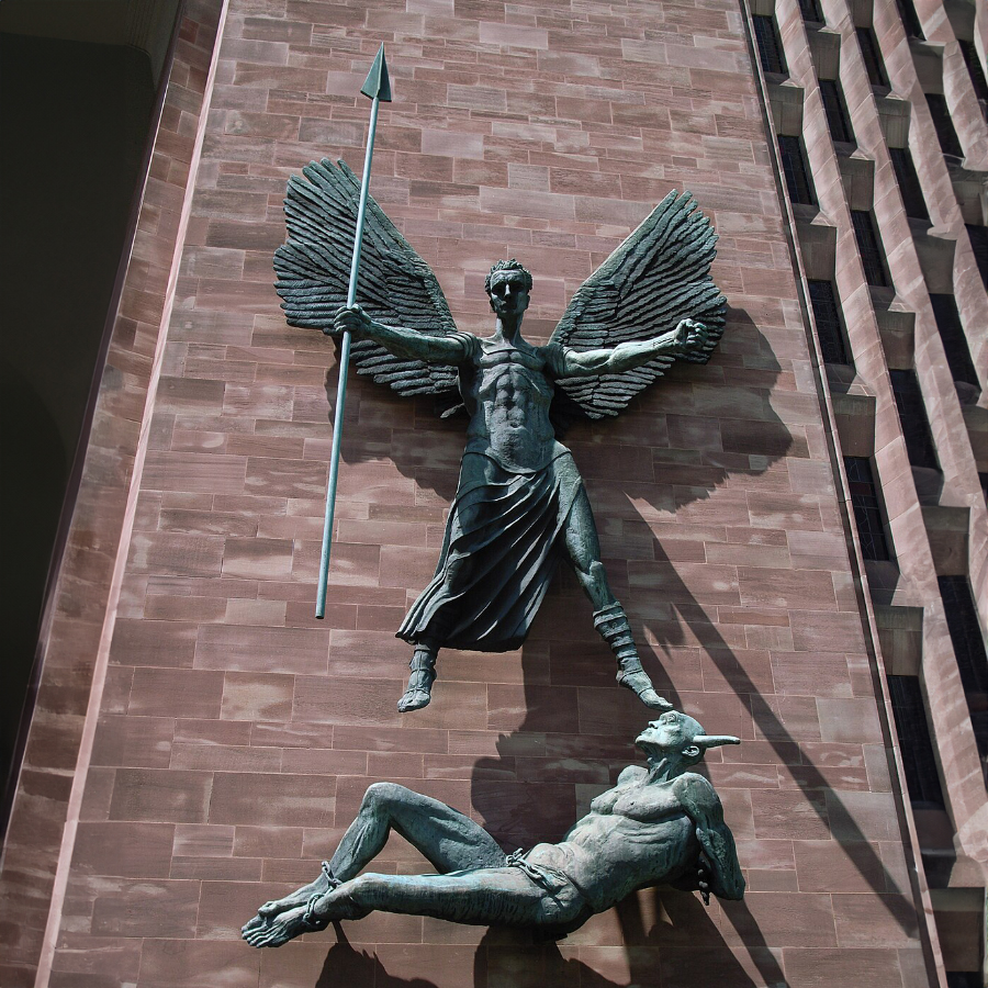 Bronze sculpture of Archangel Michael defeating Satan on the façade of Coventry Cathedral