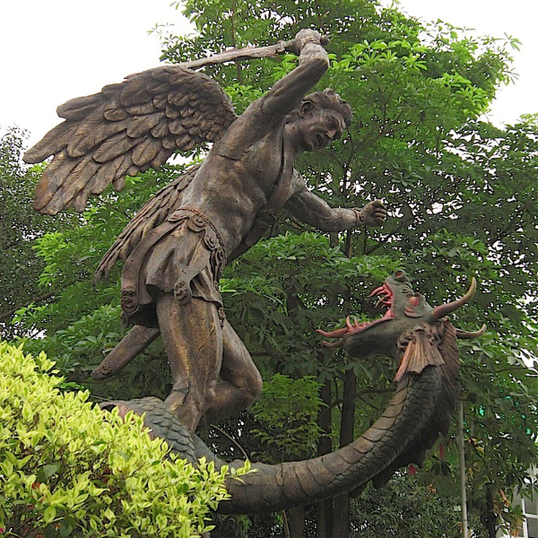 Bronze statue of Archangel Michael slaying a dragon