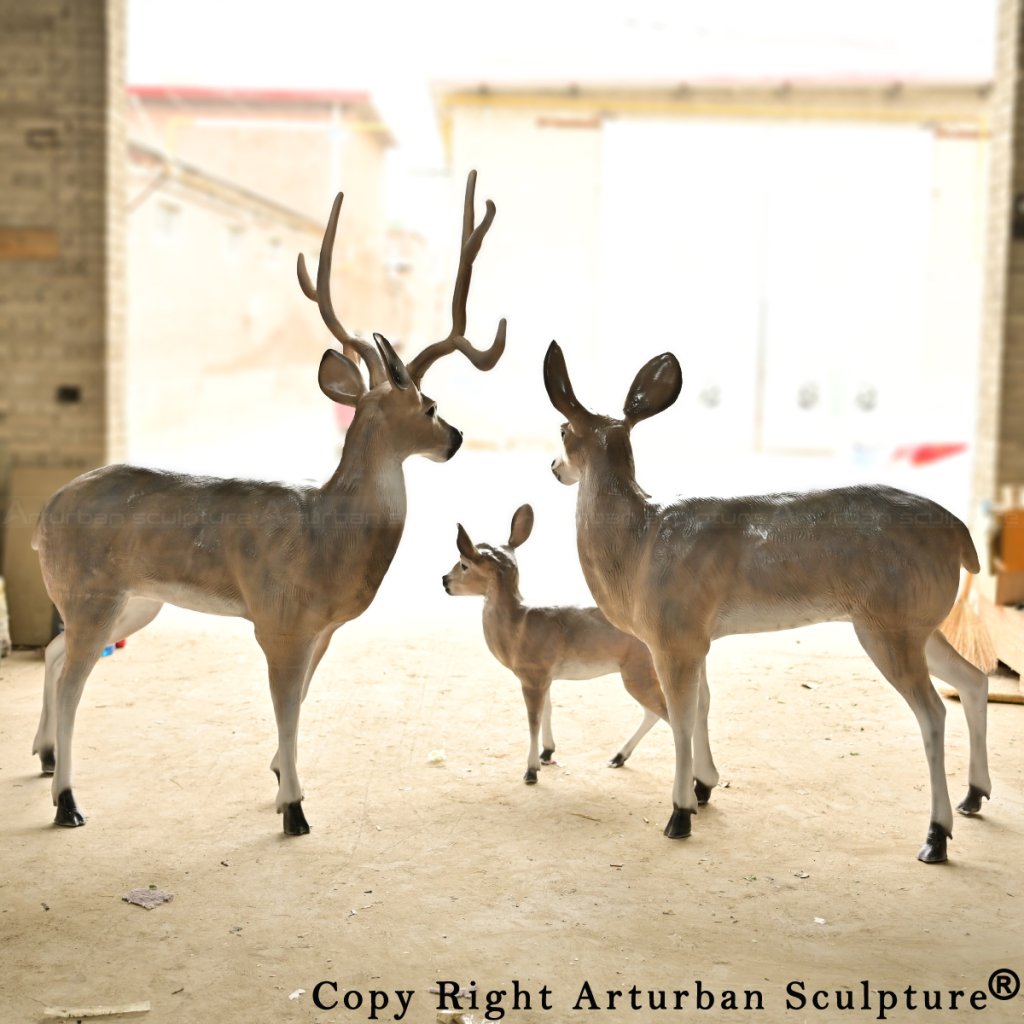 Fiberglass Whitetail Deer Family Sculpture displayed in outdoor lighting, highlighting antlers and body contour