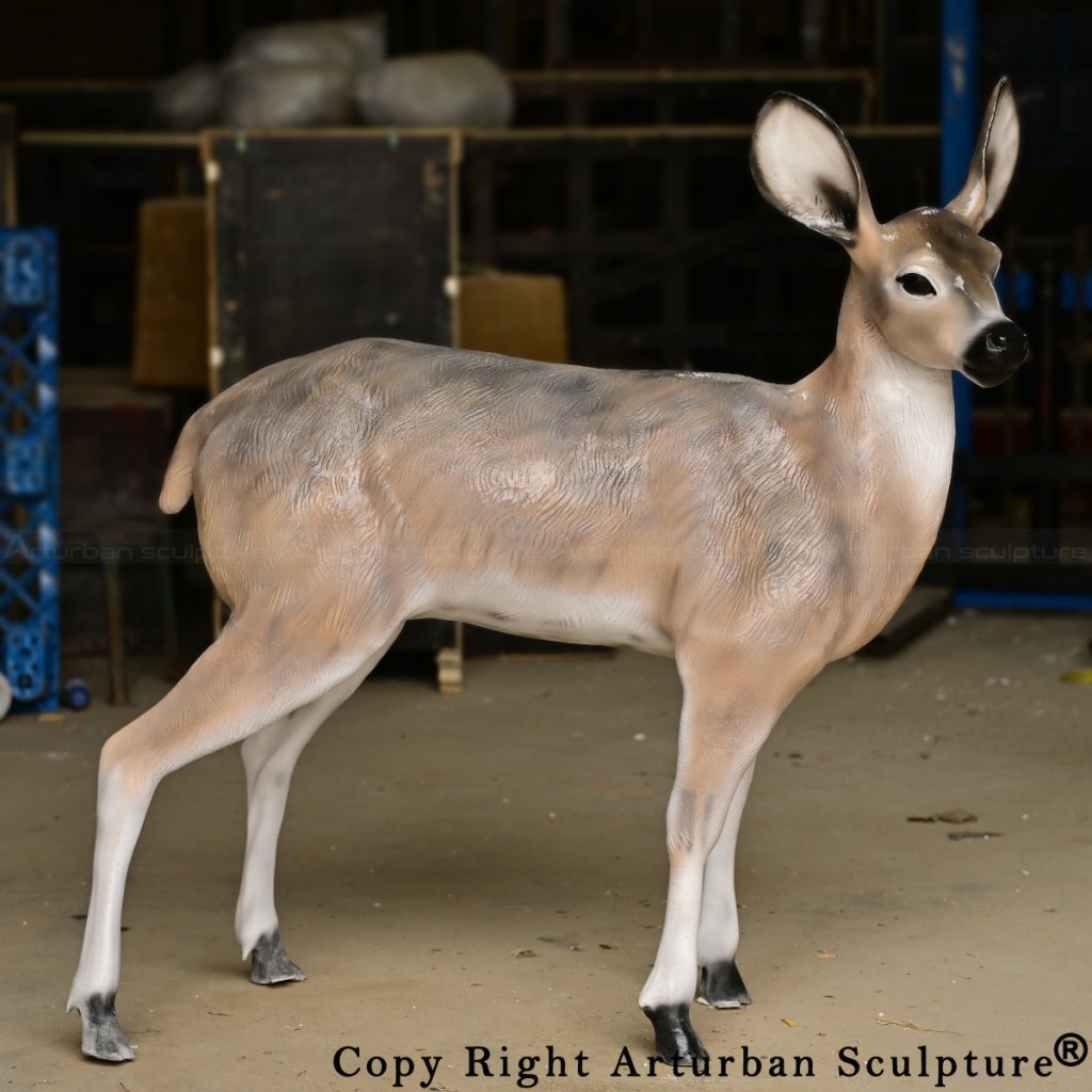 Fiberglass whitetail deer sculpture of a doe standing upright, featuring realistic texture and soft brown-white gradient