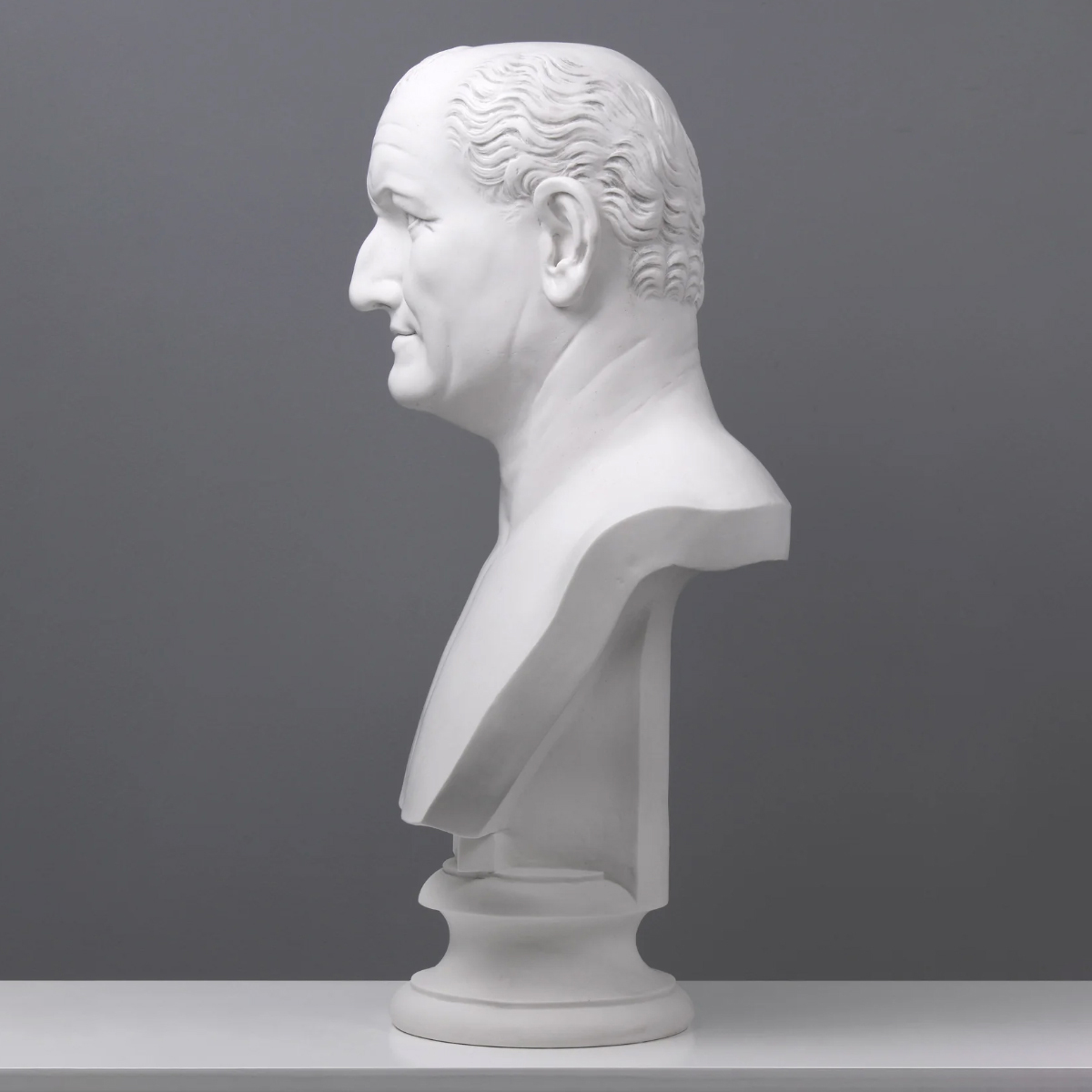 Marble bust of Emperor Vespasian featuring Roman realism and distinct facial structure