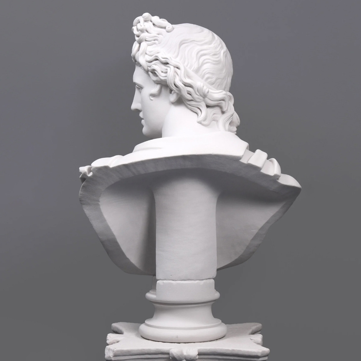 Rear view of Apollo Marble Bust with visible hair curls
