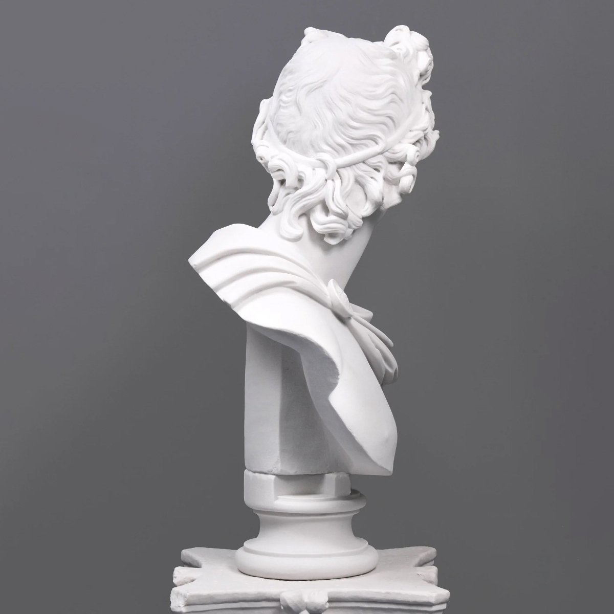 Side view of Apollo Marble Bust showing detailed curly hair and draped cloak (2)
