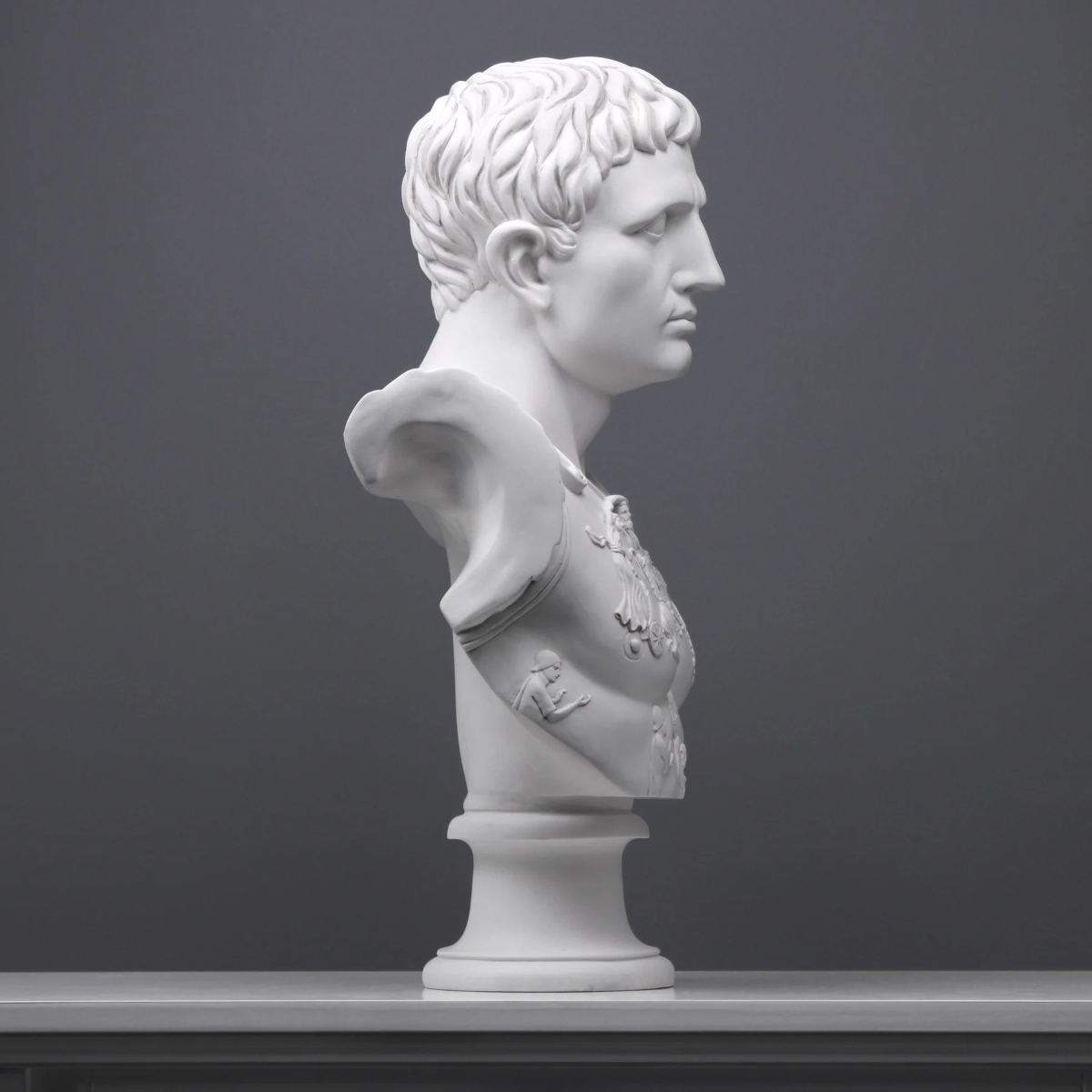 Side view of Augustus Marble Bust with intricate armor patterns