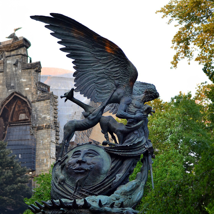 Side view of Peace Fountain showing Archangel Michael, animals, and cosmic elements