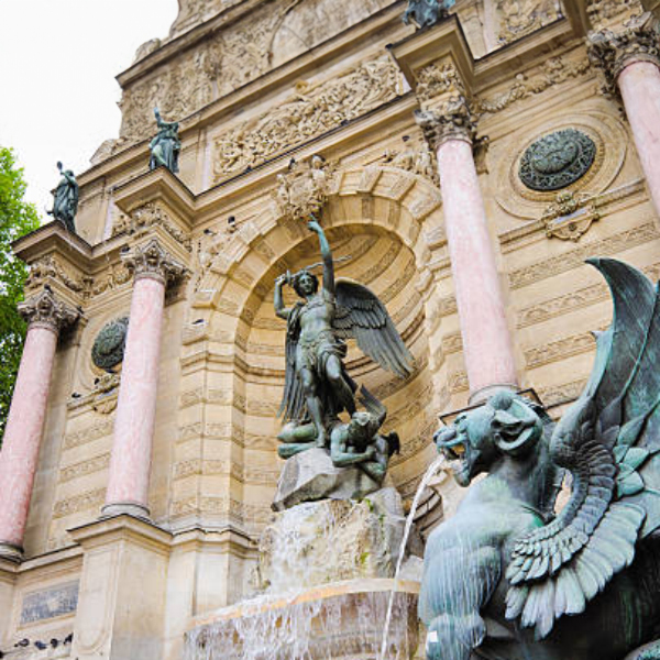 Side view of Saint Michael fountain sculpture with winged demons, Paris