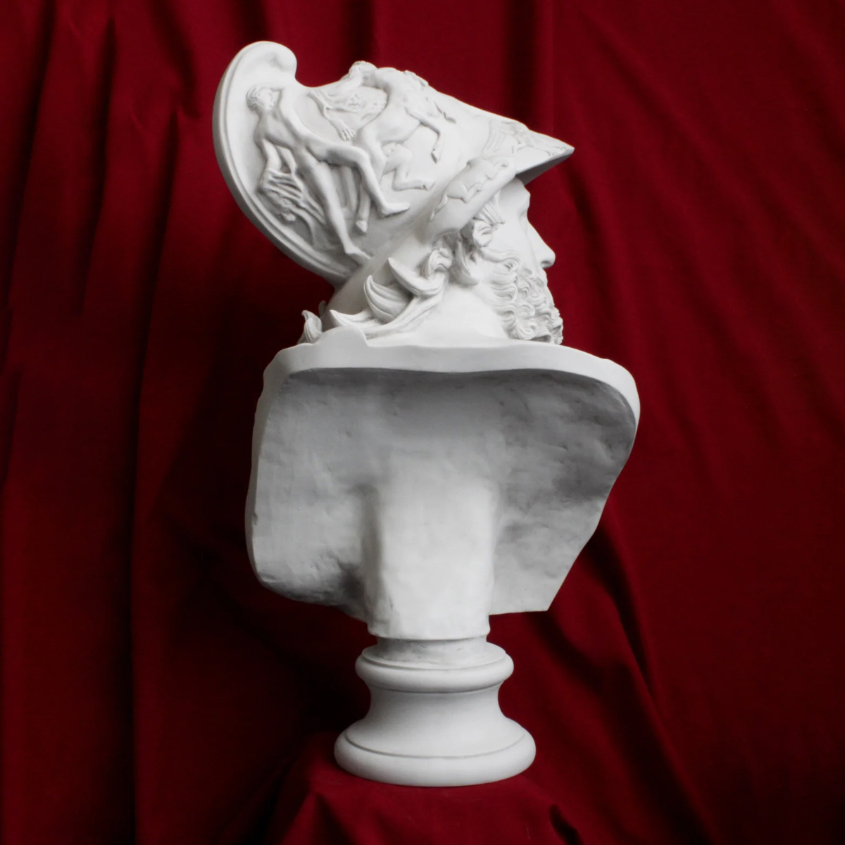 Side view of marble bust of Ajax showing mythological helmet relief
