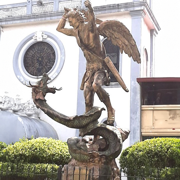 St. Michael sculpture defeating a dragon outside a church