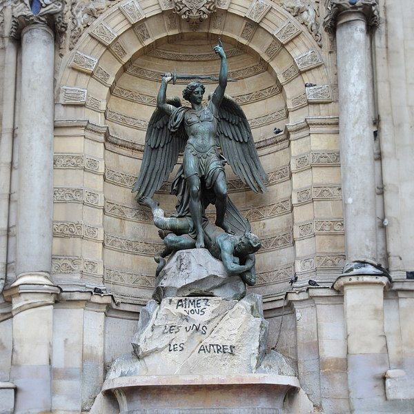 Statue of Saint Michael defeating Satan at Fontaine Saint-Michel in Paris