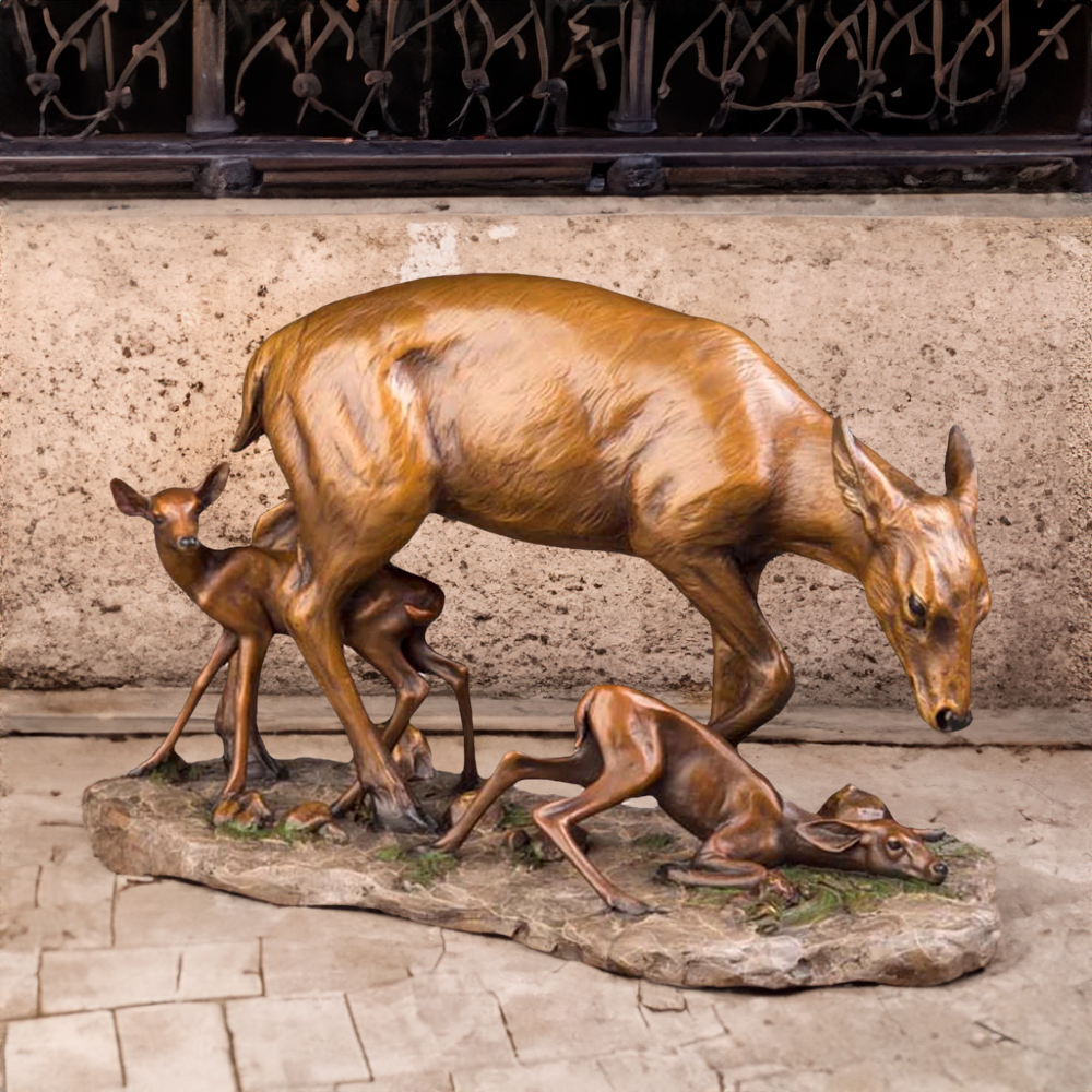 bronze Doe and Fawn Figurine showing a protective mother deer and two playful fawns