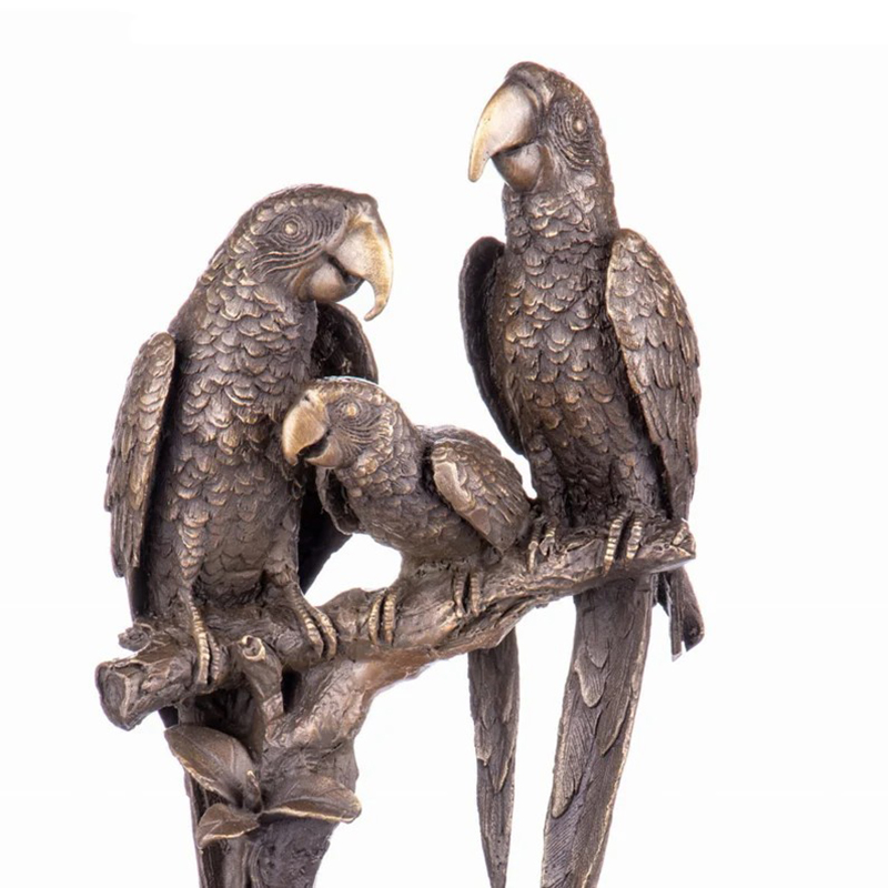 bronze Macaw Sculpture family close-up on branch