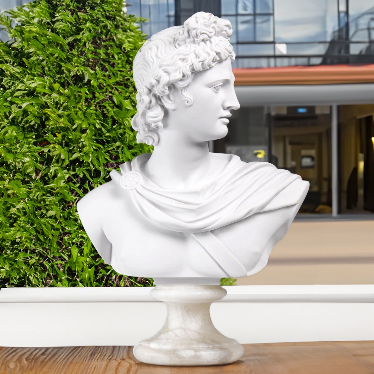 front view of the marble Apollo Head Sculpture placed outdoors