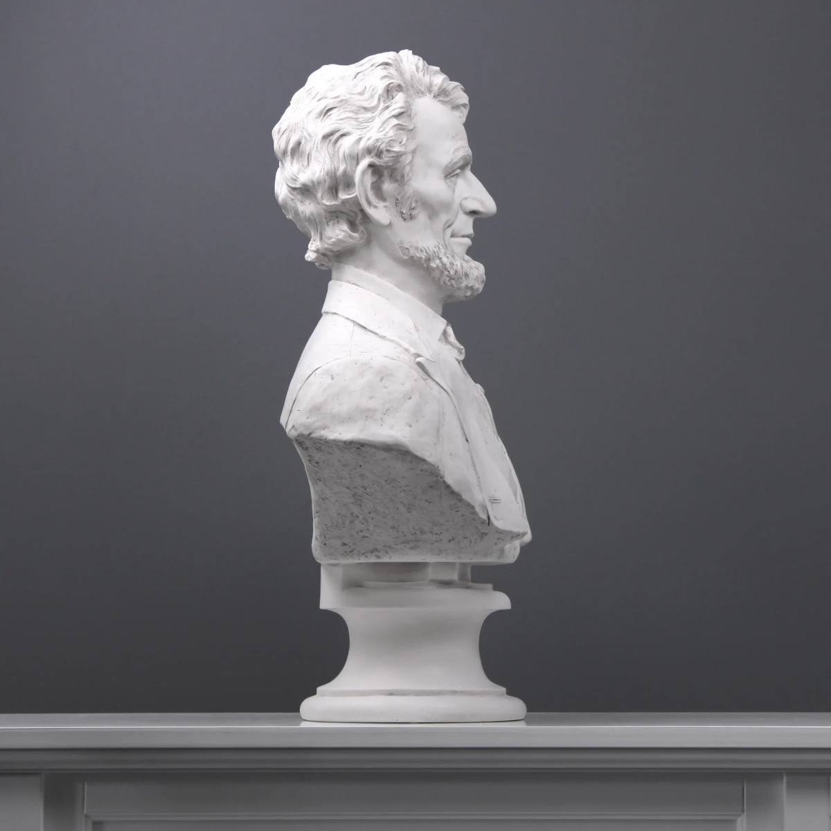 marble bust of Abraham Lincoln, showing the sculpted hair and smooth coat details