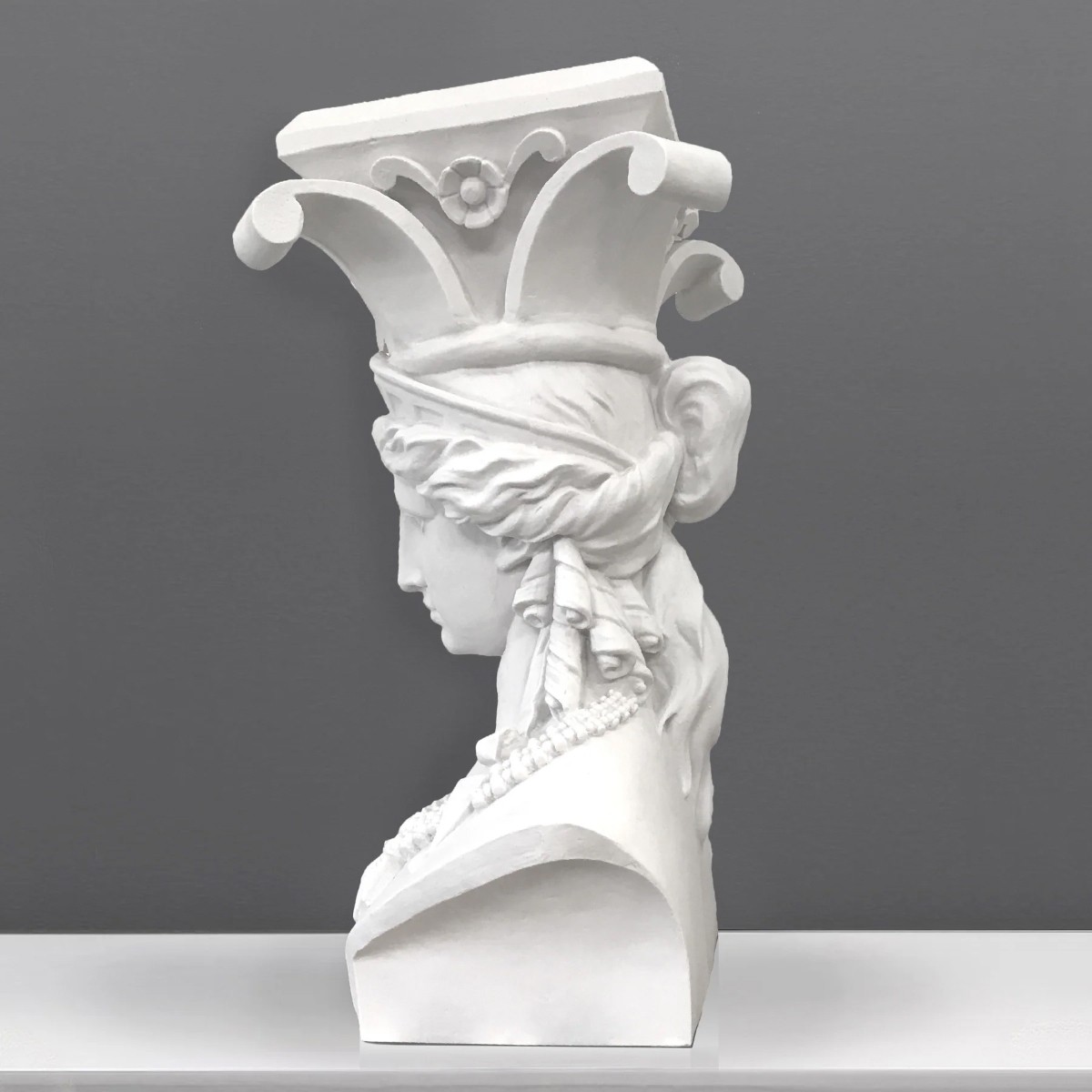 side view of caryatid bust colume sculpture