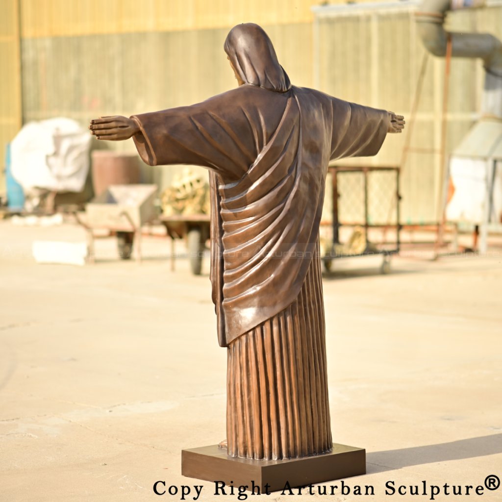 Jesus Christ the Redeemer Statue in bronze, emphasizing garment texture and posture