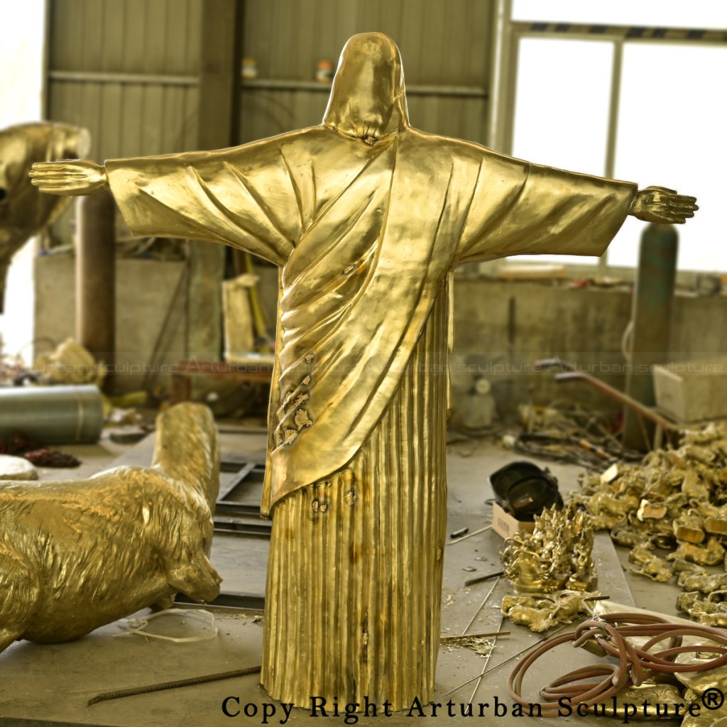 Back view of welded bronze sections of the Jesus Christ the Redeemer Statue before final polishing and patina application