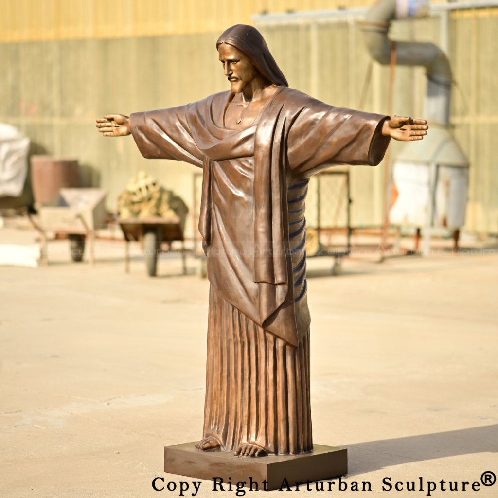 bronze Jesus Christ the Redeemer Statue capturing facial expression and open arms