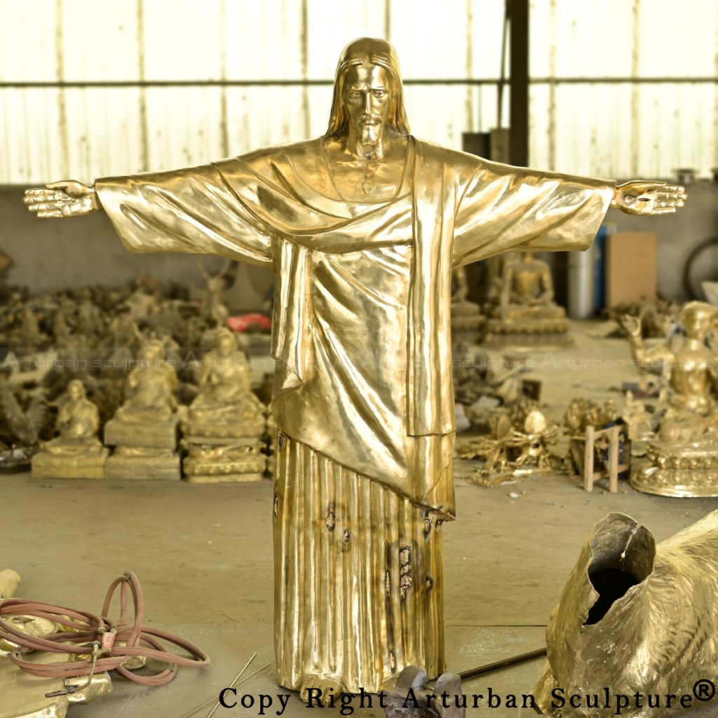 Front view of unpolished bronze Jesus Christ the Redeemer Statue during assembly stage