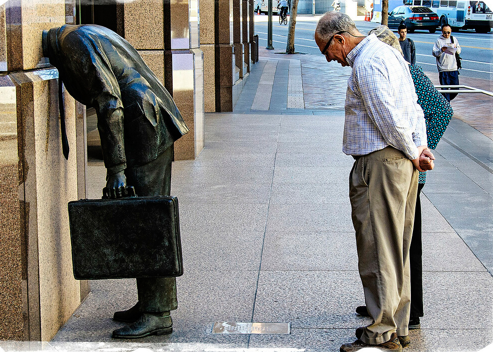 Corporate Head Sculpture showing curious pedestrians interacting with the piece