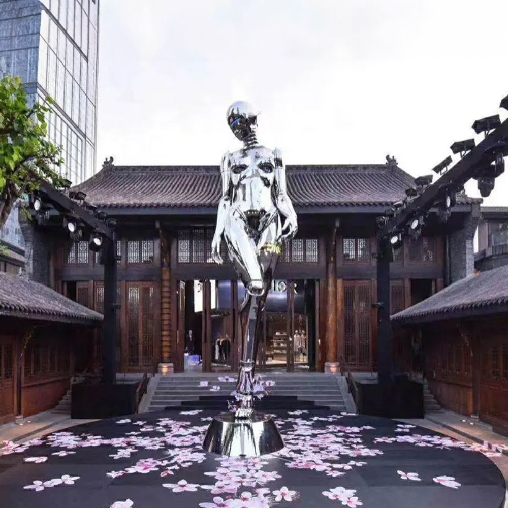 A futuristic Robot Metal Sculpture made of stainless steel