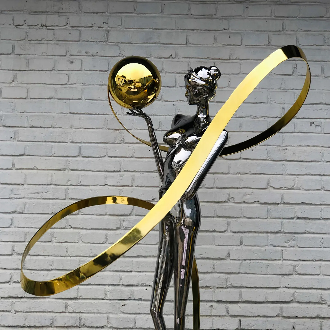 Abstract female dancing figure sculpture made of stainless steel