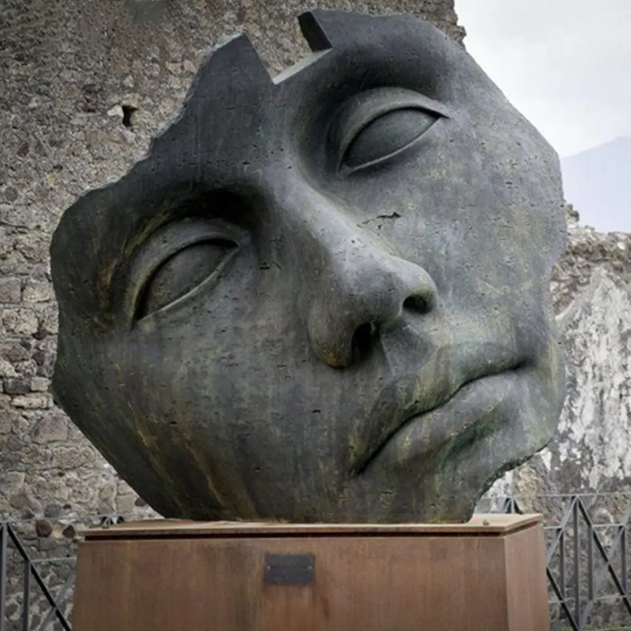 Bronze Broken Face Statue by Igor Mitoraj in outdoor