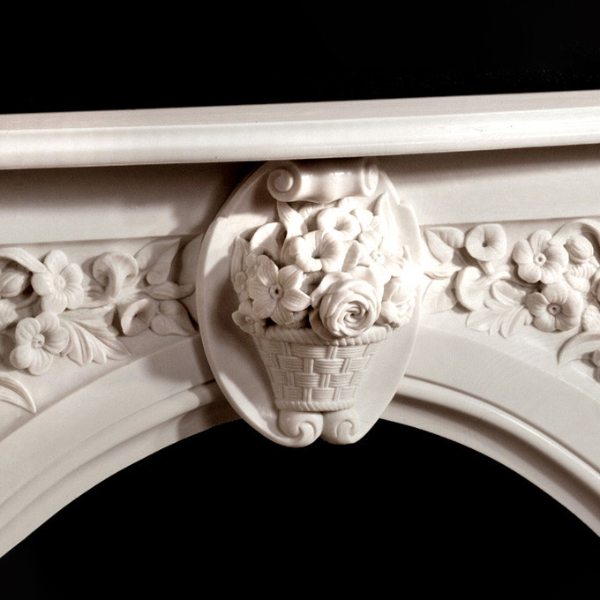 Center floral basket carving on antique marble fire surround