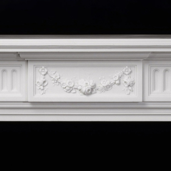 Center floral relief carving detail on The Federal Marble Fire Mantel