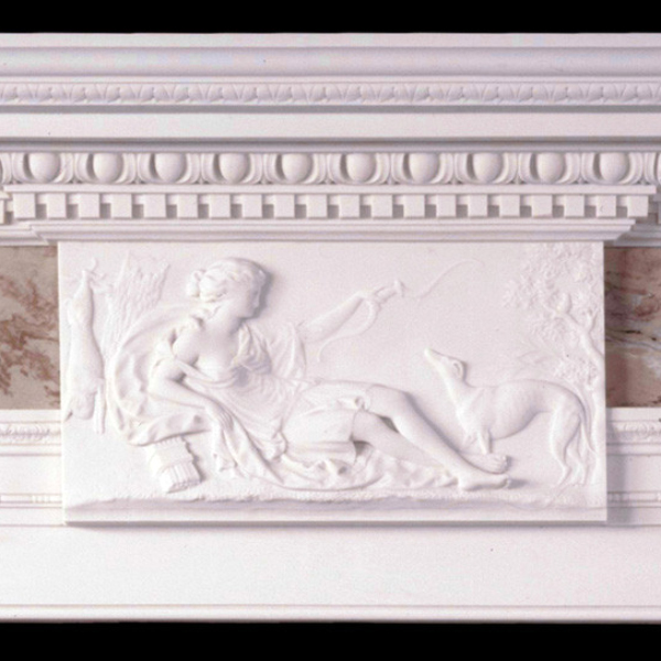 Classical relief sculpture of a woman with a dog on the central panel of a Marble Fireplace Mantel Surround