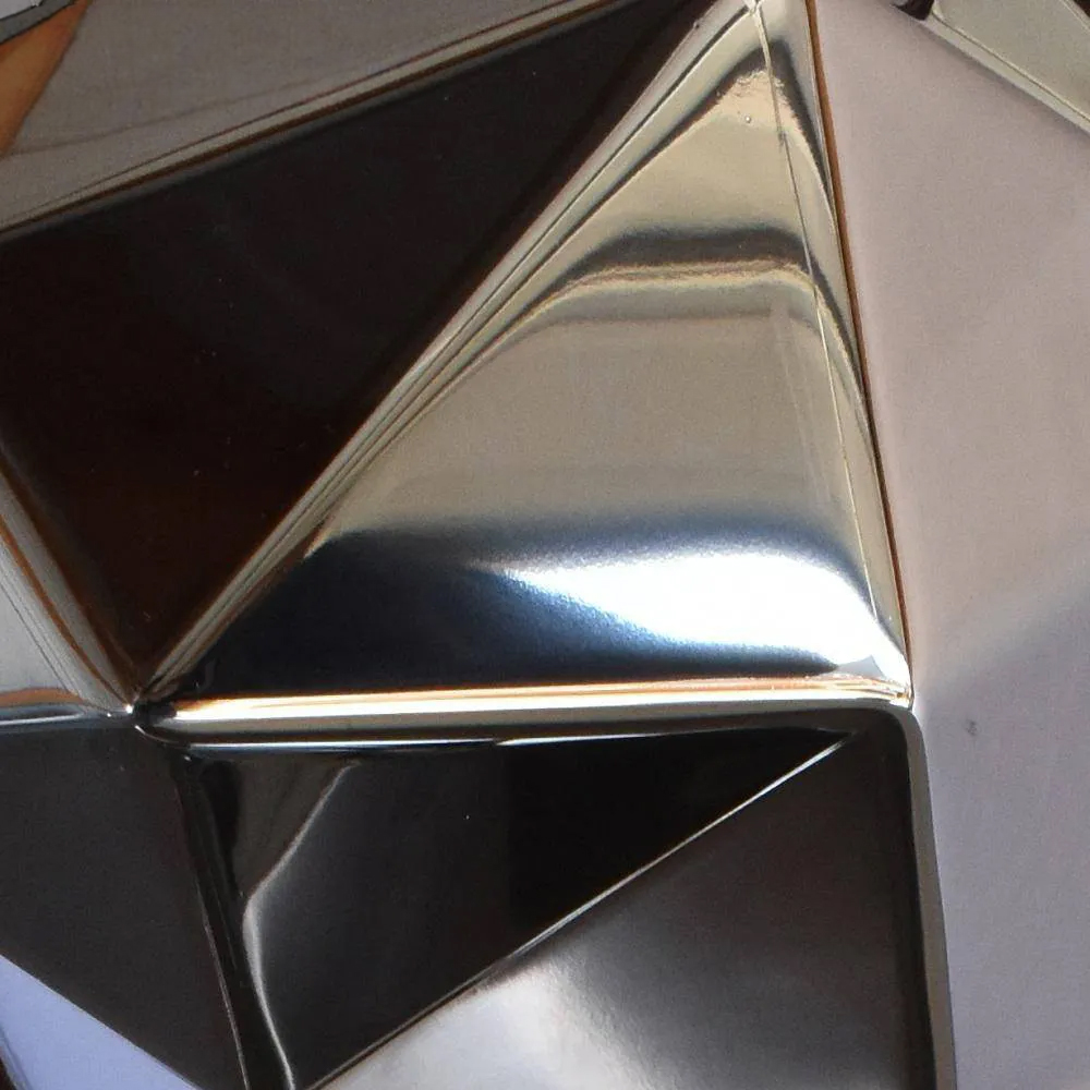 Close-up of Stainless Steel Geometric Cat Sculpture highlighting faceted details