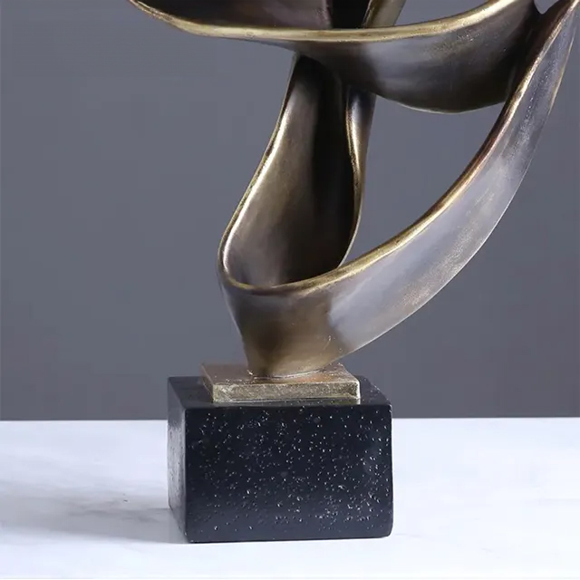 Close-up of bronze Abstraction in Sculpture showing textured curves and elegant base details
