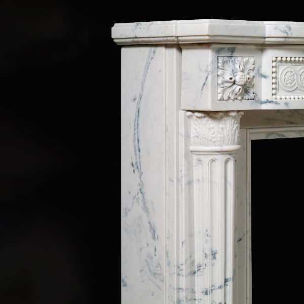 Close-up of floral detail and Corinthian capital on French Marble Fireplace Mantel