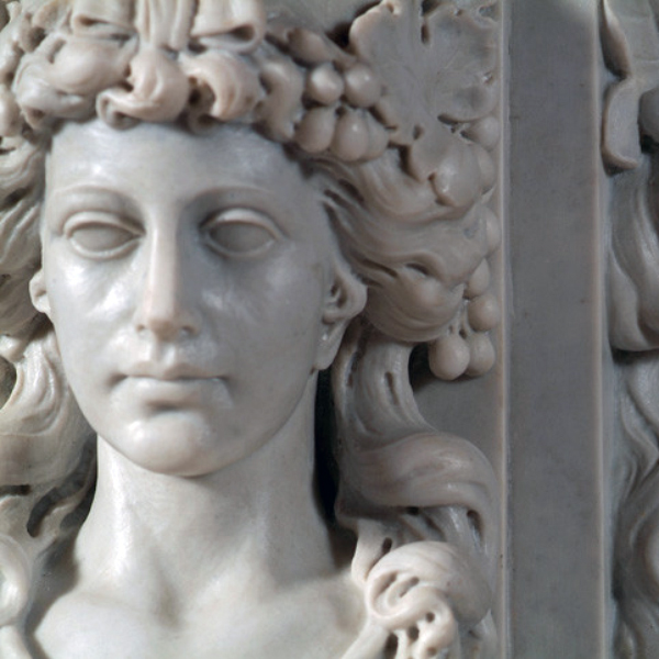 Close-up of sculpted female face on Italian Marble Mantel