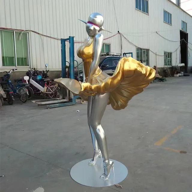 Contemporary stainless steel female statue art with blowing gold skirt