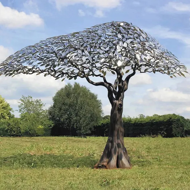 Contemporary tree garden sculpture featuring stainless steel canopy and bronze steel