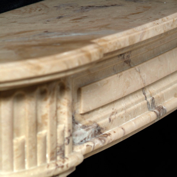 Detailed corner carving on French Style Fireplace Surround