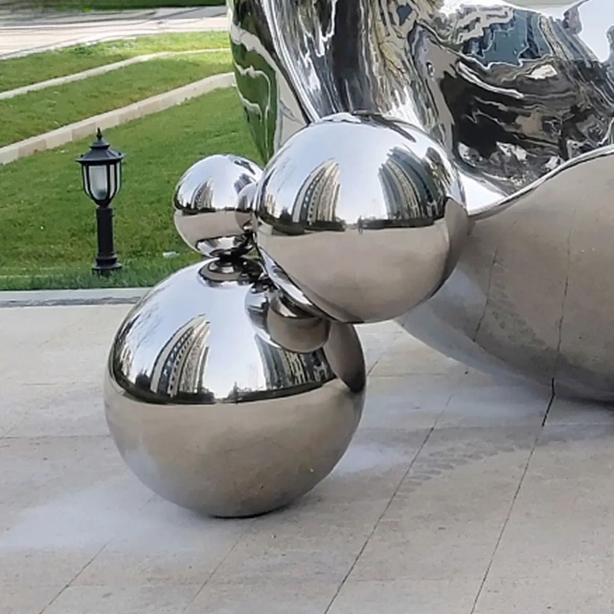 Detailed image of spherical elements at the base of Large Stainless Steel Garden Sculptures