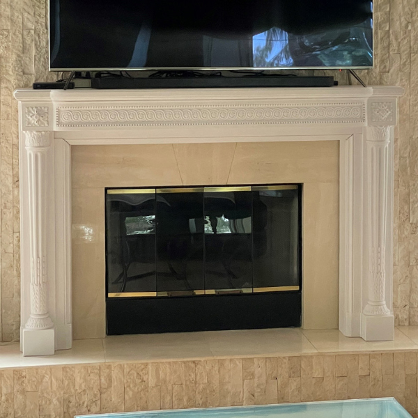 French Marble Fireplace Mantel installed in a modern living room setting