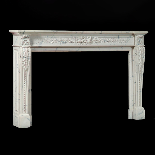 French Marble Fireplace Surround displaying ornate neoclassical carvings