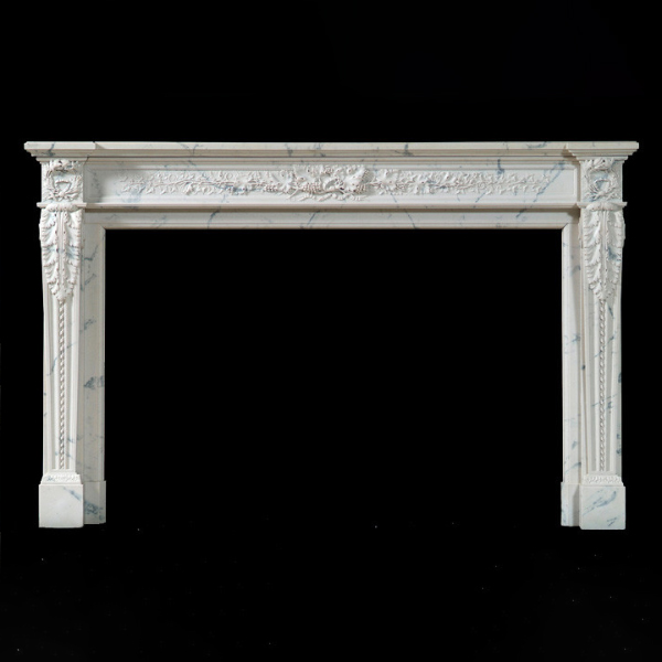 French Marble Fireplace Surround showcasing symmetrical floral decorations