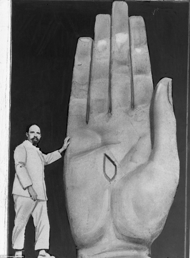 French-Polish sculptor Paul Landowski shown at work on a hand for the sculpture