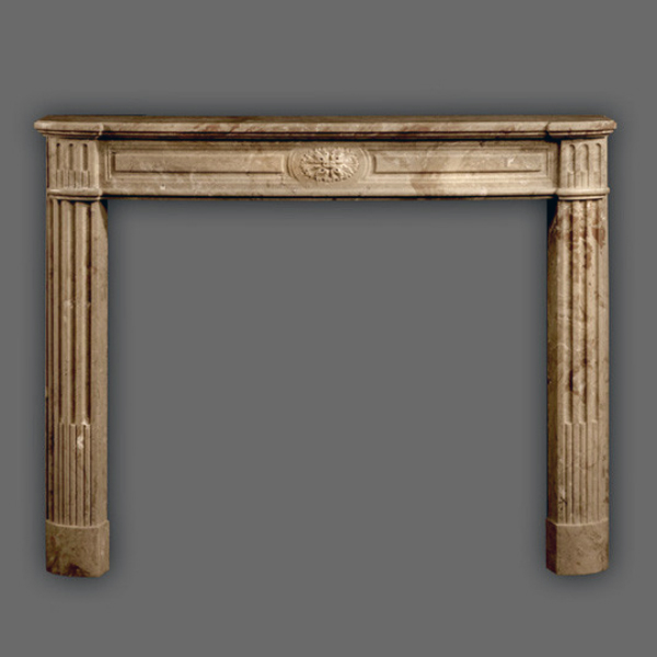 French Style Fireplace Surround with fluted columns and floral centerpiece