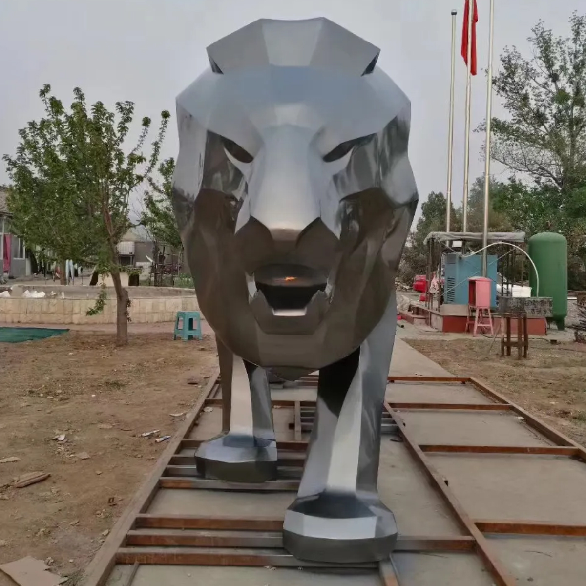 Front view of a stainless steel Metal Lion Sculpture with low-poly design