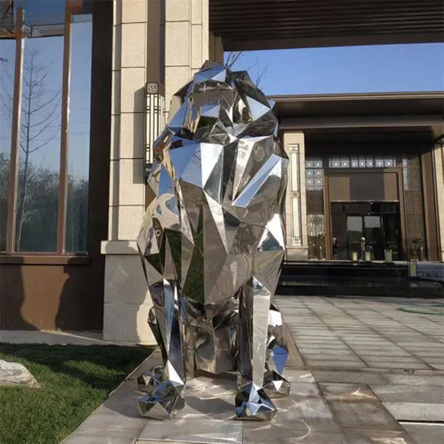Front view of a stainless steel lion sculpture featuring faceted surfaces