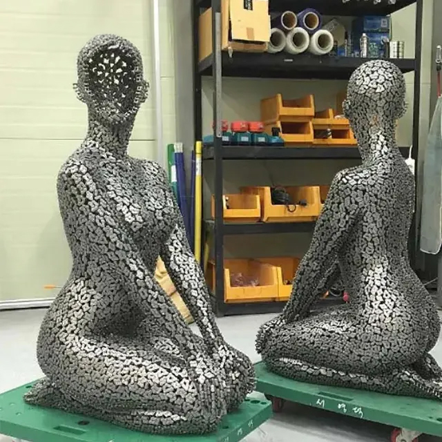 Industrial aesthetic Sculpture Female Figure constructed from stainless steel chains