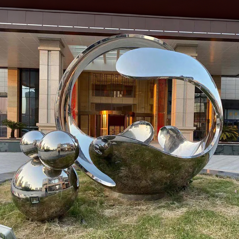 Large Stainless Steel Garden Sculptures with abstract shell-like form and cluster of polished spheres