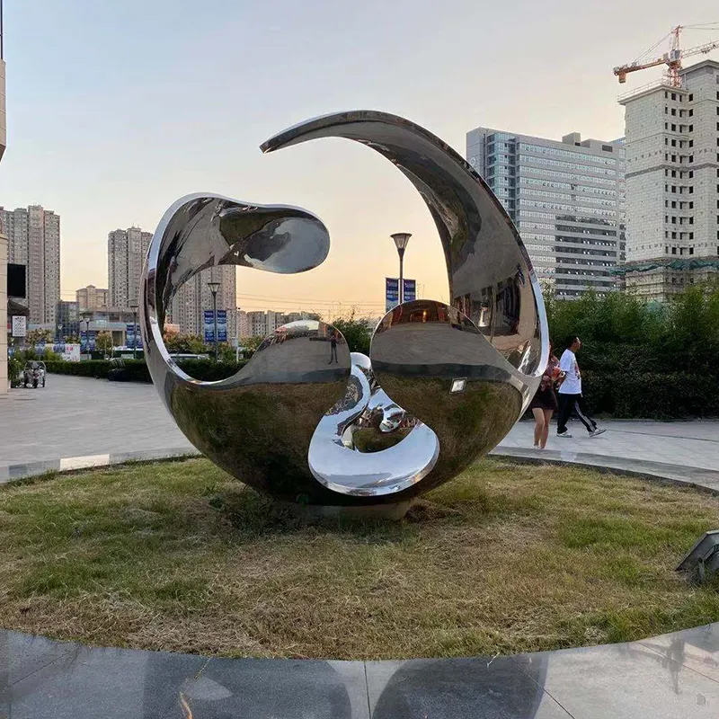 Modern Large Stainless Steel Garden Sculptures set on grass lawn